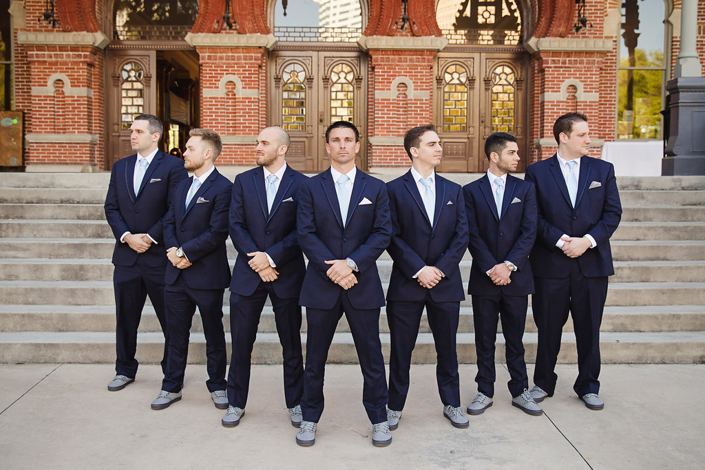 Outdoor Groom and Groomsmen Wedding Party Portrait in Navy Tuxedo with Light Blue Ties and Silver Pocket Squares and and Grey Sneakers | Tampa Bay Photographer Marc Edwards Photographs