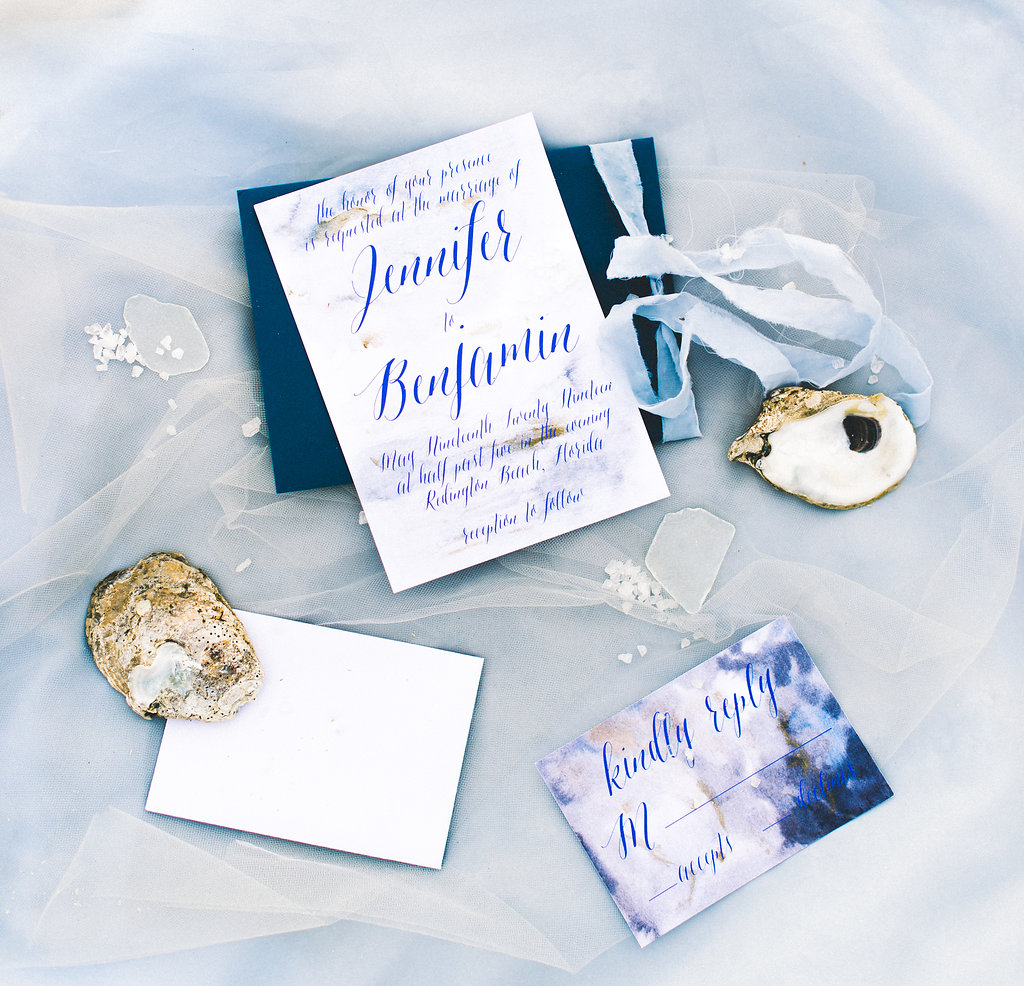 Blue Coastal Watercolor Invitation Suite with Light Blue Ribbon and Oyster Shells
