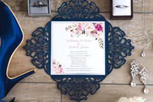 Romantic Navy Blue Lasercut Design and White and Pink Floral Square Wedding Invitation, Diamond Chandelier Earrings, Diamond Necklace, Wedding Bands in Ringboxes and Blue Sating Peep Toe Shoes