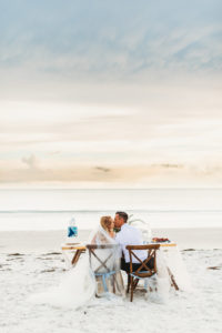 Waterfront, Sandy White Redington Beach Wedding Reception Bride and Groom Portrait in Wooden Crossback Chairs with Tulle