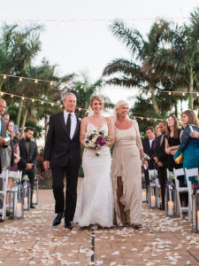 Bride Walking Down the Aisle with Father and Mother Ceremony Portrait, with White Rose, Pink, Deep Purple Flowers and Greenery Bouquet | Clearwater Wedding Venue Feather Sound Country Club