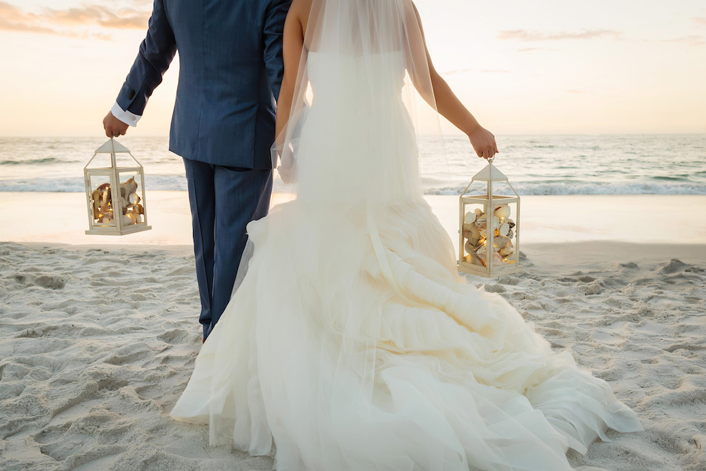 Sunset Wedding Portrait on Clearwater Beach, Bride and Groom Holding White Lanterns with Seashells | Hotel Wedding Venue | Hyatt Regency Clearwater