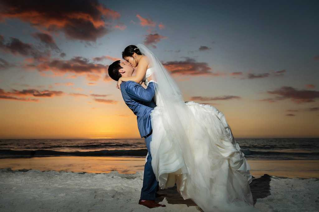 Romantic Outdoor Beach Sunset Bride and Groom Wedding Portrait, Bride in White Trumpet Organza Wedding Dress and Veil, Groom in Blue Suit | Luxury Wedding Venue Hyatt Regency Clearwater Beach