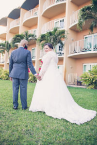 Outdoor Bride and Groom Portrait, Long Sleeve Illusion, V-Neck Lace and Rhinestone Floral Accent Wedding Dress, Groom in Grey Suit with Rose Boutonniere | Tampa Bay Wedding Photographer Luxe Light Photography