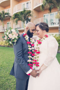 Outdoor Bride and Groom Intimate Wedding Portrait Wearing Pink Floral Leis | Tampa Bay Wedding Photographer Luxe Light Photography