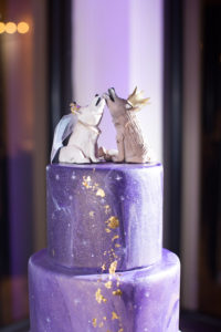 Four Tier Marble Ombre Enchanted Magical Purple and Champagne Cake and Amethyst Geode, Gold Leafing Painted Cascading Stars and Shimmer Airbrushing with Custom Wolf and Fox Cake Topper on Acrylic Cake Stand and Gold Votive Candle Holders on Champagne Tablecloth | Clearwater Beach Wedding Venue Feather Sound Country Club | St. Petersburg Wedding Baker The Artistic Whisk