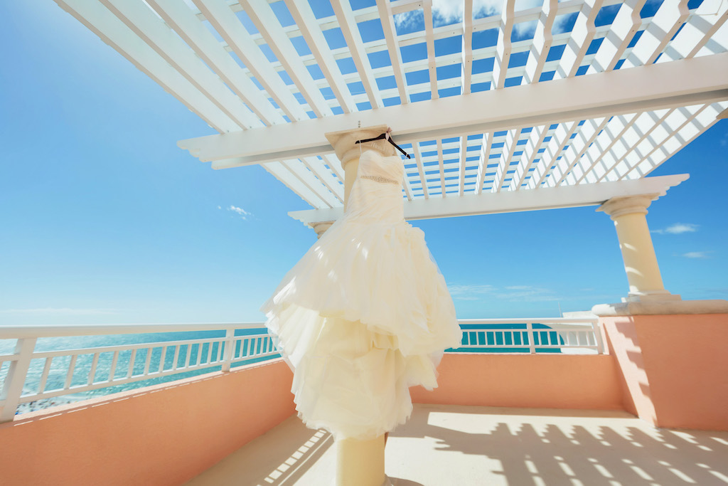 Strapless, White Trumpet Organza Wedding Dress with Rhinestone Belt on Personalized Hanger on Rooftop Terrace of Hyatt Regency Clearwater Beach