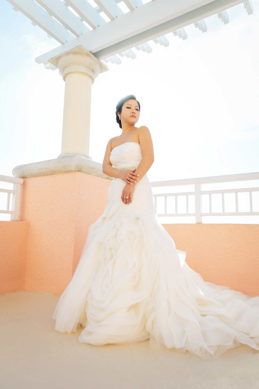 Outdoor Waterfront Hotel Rooftop Bridal Portrait, Bride in Strapless White Trumpet Organza Wedding Dress and Rhinestone Belt | Venue Hyatt Regency Clearwater Beach
