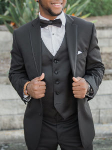 Outdoor Groom Wedding Portrait in Black Tuxedo with Black Bowtie and Vest