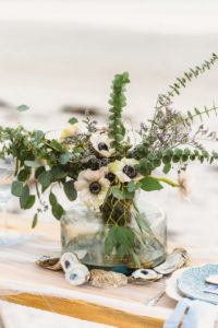 Waterfront, Coastal St. Pete Beach Wedding Reception Decor, Low Glass Vase with Greenery and White Anemone Floral Centerpiece with Oyster Shells