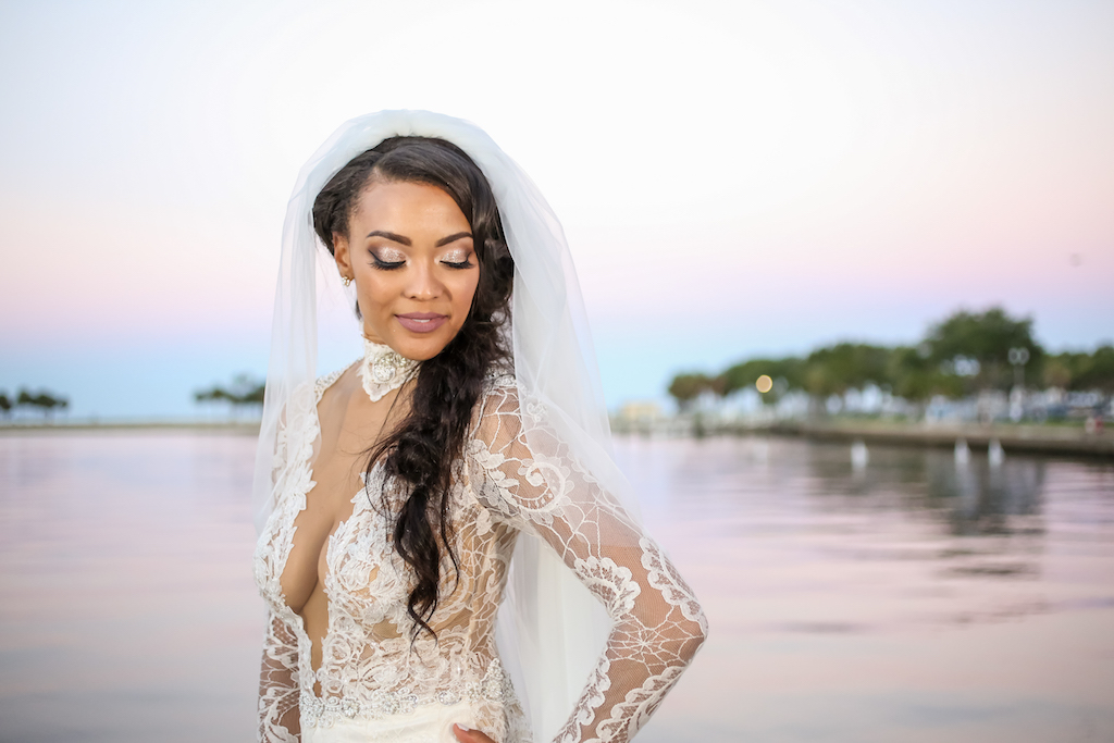 Outside Bridal Portrait, Lace and Sheer Long Sleeve Low V-Neck Wedding Dress and Braided Hairstyle with Veil | St. Petersburg Photographer Lifelong Photography Studios