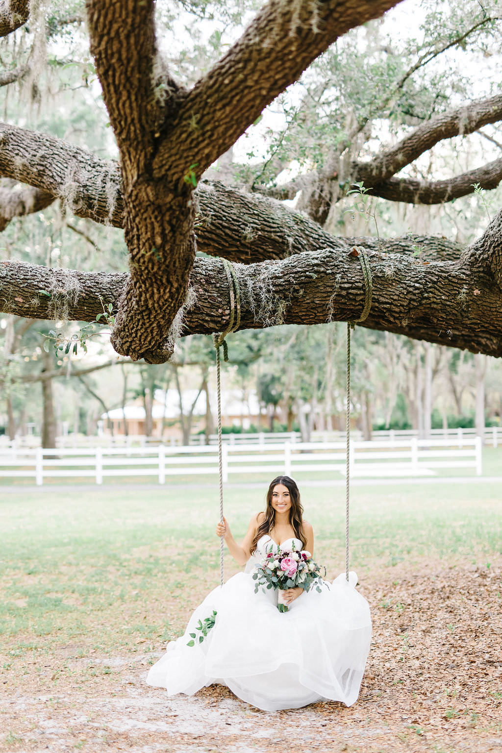 Outdoor Bride Wedding Portrait on Swing from Tree | Tampa Bay Wedding Planner Burlap to Lace | Venue The Lange Farm