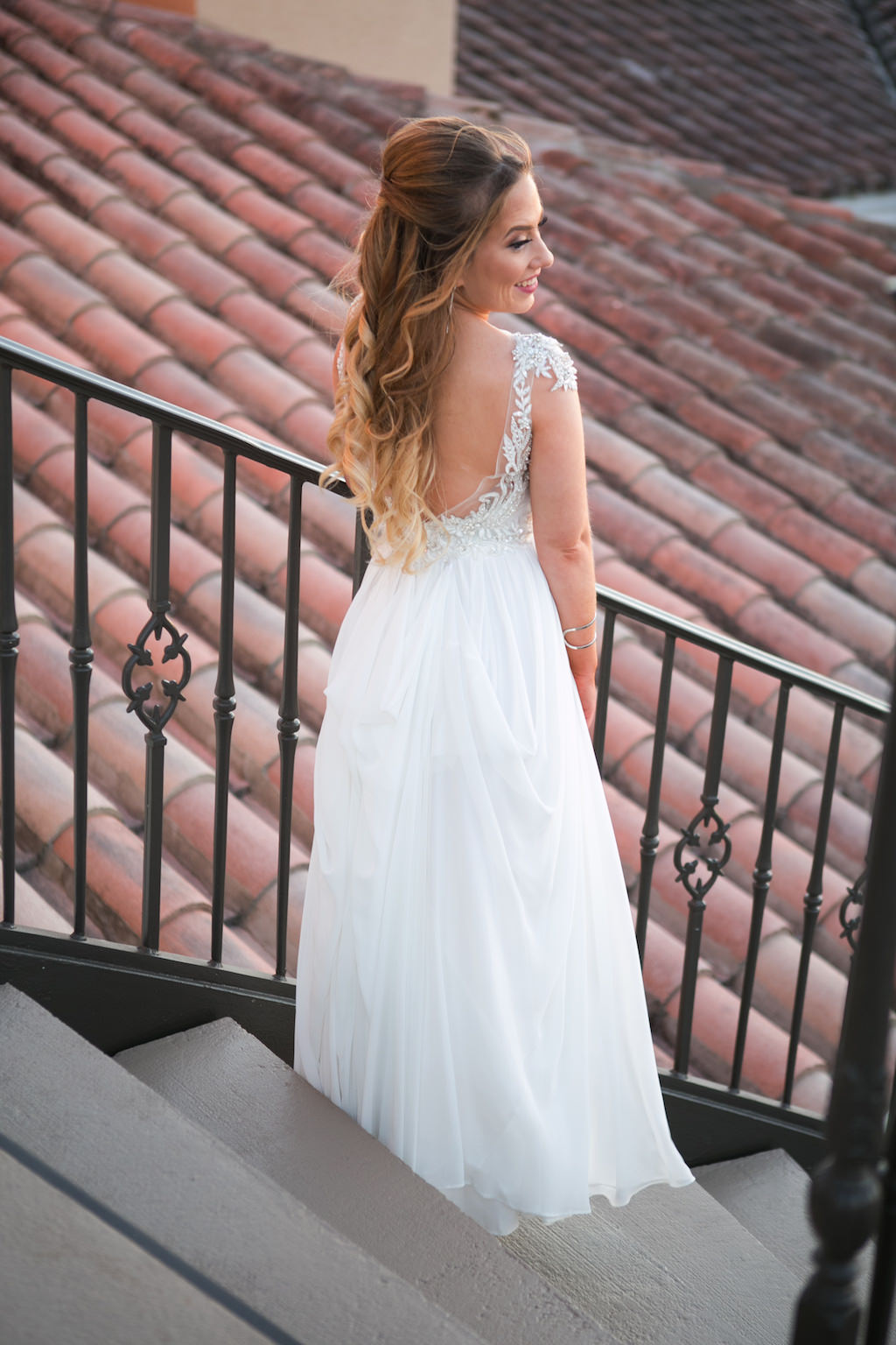 Outdoor Bridal Portrait on Staircase in Maggie Sottero A-Line Illussion Tank Top Low-Back Wedding Dress with Lace Applique and Rhinestone Beaded Bodice | Sarasota Wedding Photographer Carrie Wildes Photography