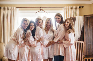 Bride and Bridesmaids Getting Ready Wedding Portrait in Silk Blush Pink Robes