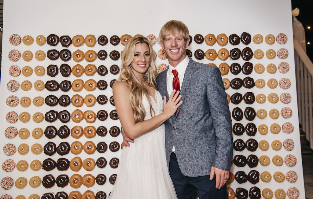Bride and Groom Wedding Portrait with Donut Doughnut Wall Backdrop | Tampa Bay Wedding Planner Kelly Kennedy Weddings and Events
