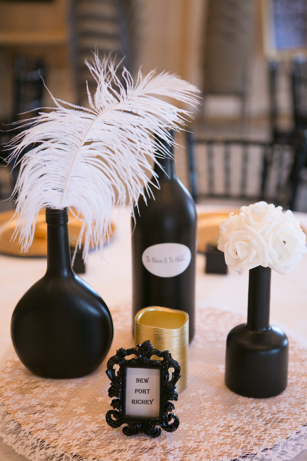 Indoor Ballroom Wedding Reception Decor, Black Vases with White Feather and Roses on Floral Linen | Sarasota Wedding Photographer Carrie Wildes Photography