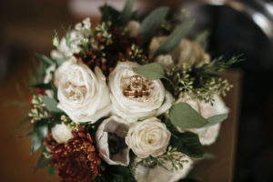 Vintage Inspired Wedding Bouquet with Ivory Roses, Burgundy Flowers and Greenery Bouquet with Rose Gold Engagement Ring and Wedding Ring | Tampa Bay Planner Kelly Kennedy Weddings and Events