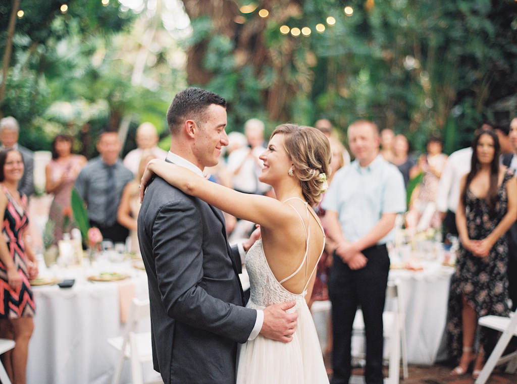 Tropical Garden Wedding Reception First Dance Wedding Portrait, Bride in Strappy Open Back Lace A Line Wedding Dress, Groom in Grey Suit | Outdoor St. Petersburg Wedding Venue Sunken Gardens | Planner Southern Glam Events and Weddings