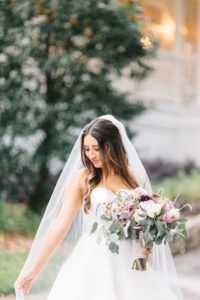 Outdoor Bride Wedding Portrait in Sweetheart Strapless Ballgown Wedding Dress and Veil with Pink, White and Greenery Floral Bouquet | Tampa Bay Wedding Planner Burlap to Lace