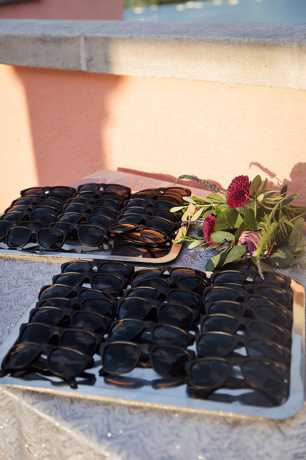 Black Sunglasses Wedding Favors on Silver Sparkle Tablecloth | Over the Top Rental Linen