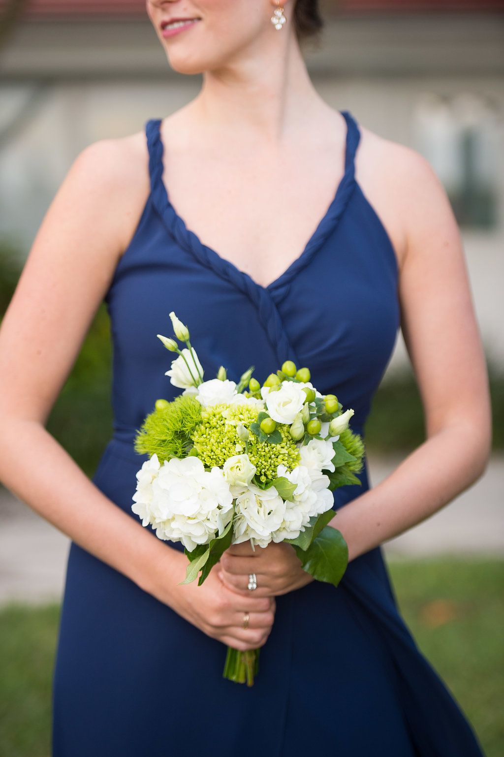 Bridesmaid in Navy Blue Bridesmaid Dress Holding Bouquet with Greenery and White Hydrangeas | Bella Bridesmaids, Joanna August