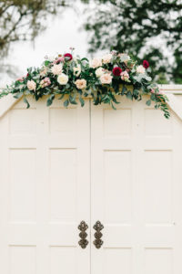 Wedding Ceremony Decor, Two White Doors with Greenery, White, Dark Red, and Blush Pink Floral Bouquet | Tampa Bay Wedding Planner Burlap to Lace