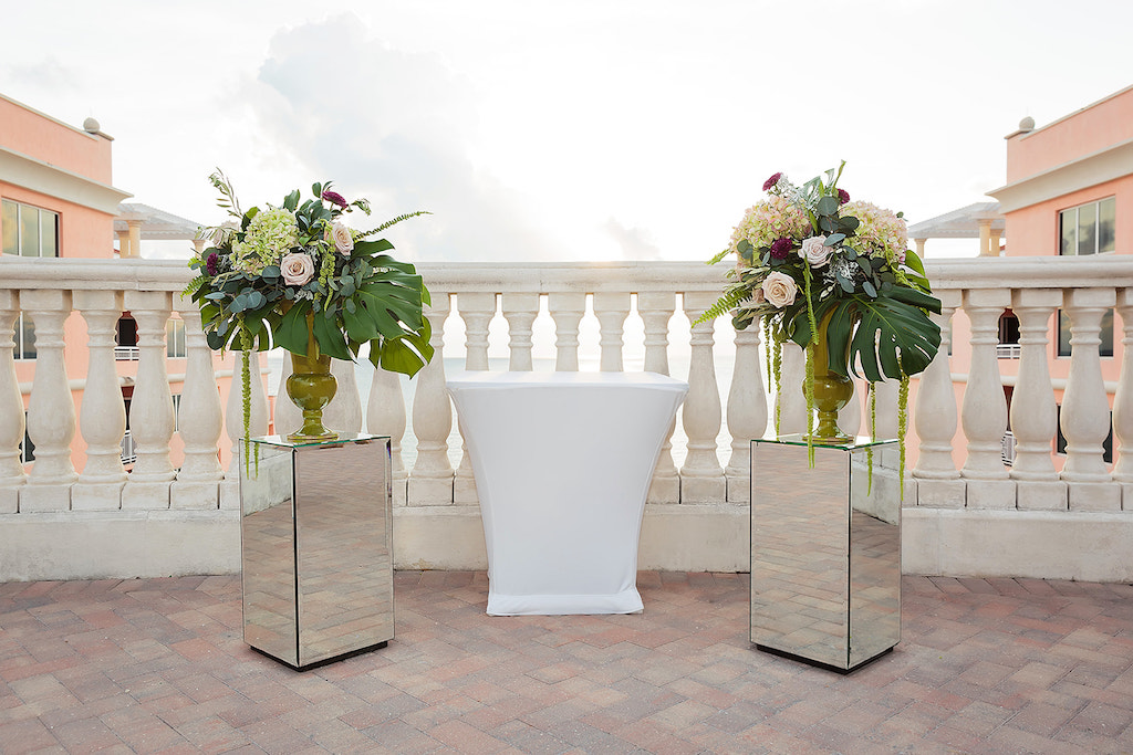 Outdoor Rooftop Terrace Wedding Ceremony Decor, Mirror Pedestals with Tall Gold Vases and Blush Pink Rose, Hydrangeas, Amaranthus, Monstera Leaves and Greenery | Tampa Bay Florist 2Birds Events | Venue Hyatt Regency Clearwater Beach