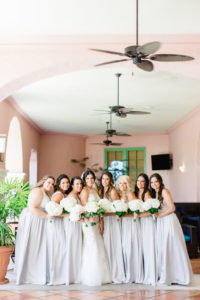 Bride and Bridesmaids Wedding Portrait in High Halter Lace and Rhinestone Bodice Wedding Dress, and Grey Bridesmaids Dresses with White Floral Bouquets | Tampa Hair and Makeup Artist Femme Akoi | St. Petersburg Photographer Ailyn La Torre Photography