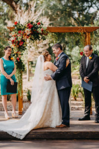 Outdoor Tropical Bride and Groom Wedding Ceremony Portrait | Tampa Bay Photographer Rad Red Creative | Rustic Venue Cross Creek Ranch