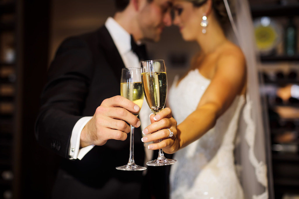 Bride and Groom Creative Wedding Portrait with Champagne Glasses