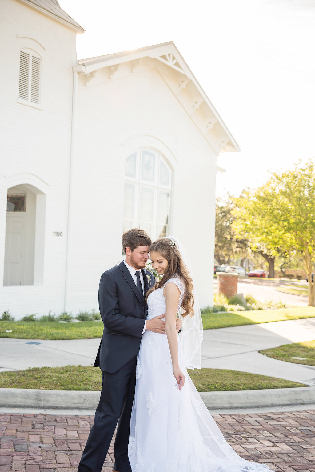 Outdoor Bride and Groom Wedding Portrait, Bride in A-Line Lace and Cap Sleeve Wedding Dress and Veil | Tampa Bay Photographer Kristen Marie Photography | Venue Palm Harbor White Chapel and Harbor Hall