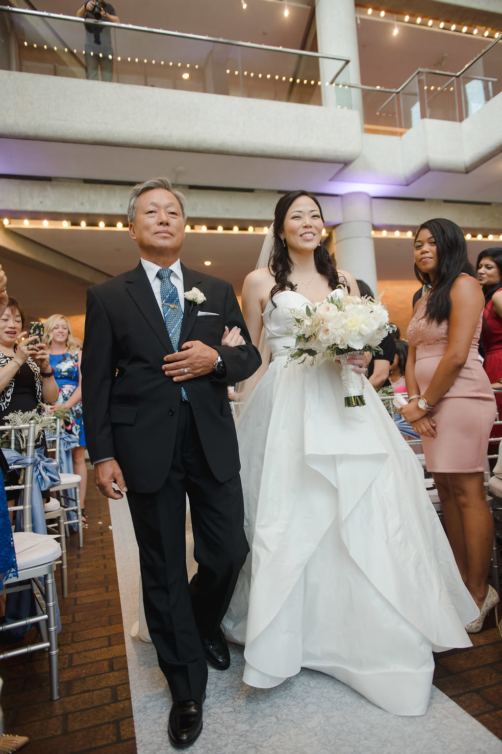 Bride Walking Down the Aisle with Father, Bride in Strapless Sweetheart Ballgown Wedding Dress, White and Greenery Floral Bouquet | Tampa Bay Photographer Marc Edwards Photography | Tampa Venue Straz Center