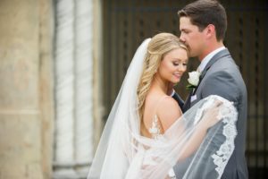 Outdoor Bride and Groom Wedding Portrait, Bride in Tulle and Lace Veil, Groom in Grey Suit and White Rose Boutonniere | Tampa Bay Photographer Andi Diamond Photography | Hair and Makeup Michele Renee the Studio