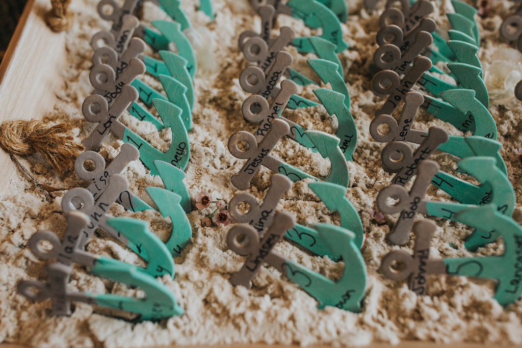 Wedding Reception Beach Inspired Table Number Decor on Custom Teal and Grey Anchors in Sand