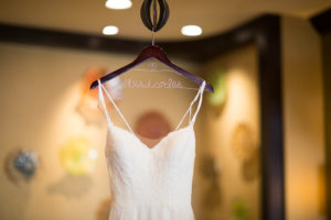 White Lace A-Line Spaghetti Strap Wedding Dress on Personalized Wooden and Wire Hanger