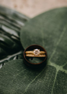 Yellow Gold Band with Round Diamond Engagement Ring and Yellow Gold Diamond Encrusted Wedding Ring in Groom's Wedding Ring | Tampa Bay Photographer Rad Red Creative