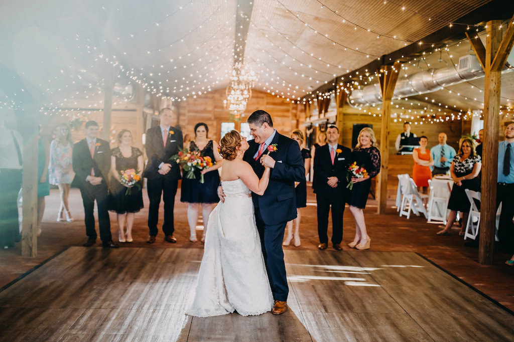Wedding Reception Bride and Groom First Dance Under String Lights | Tampa Bay Photographer Rad Red Creative | Rustic Venue Cross Creek Ranch