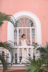 Bride in Wedding Dress by Truly Forever Bridal on Balcony | St. Petersburg Photographer Lifelong Photography Studios | St. Petersburg Historic Wedding Venue The Don Cesar | Before 5 Networking Event