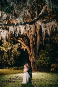 Outdoor Nighttime Bride and Groom Portrait Under Trees | Tampa Bay Photographer Rad Red Creative | Rustic Venue Cross Creek Ranch