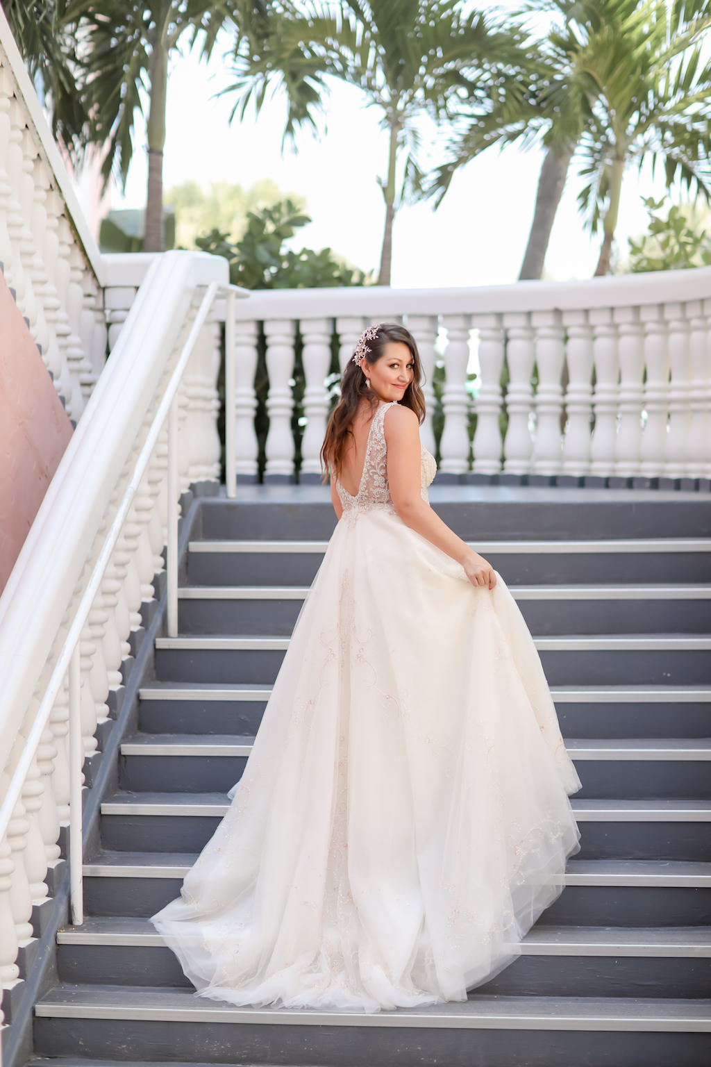 Bride Portrait on Stairs in Lace and Illusion Tank Top Strap and Low Back Wedding Dress | St. Petersburg Photographer Lifelong Photography Studios | St. Petersburg Historic Wedding Venue The Don Cesar | Instagram