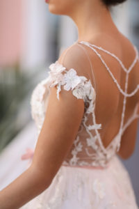 Bride Portrait in Illusion and Floral Applique, Strappy Rhinestone Back, Empire Waist High Neck with Lace Floral Cap Sleeve Wedding Dress with Blush Pink Ribbon and Ivory and Greenery Floral Bouquet | St. Petersburg Photographer Lifelong Photography Studios | Tampa Bay Wedding Dress Shop Truly Forever Bridal | St. Petersburg Historic Hotel The Don Cesar | Before 5 Networking Event