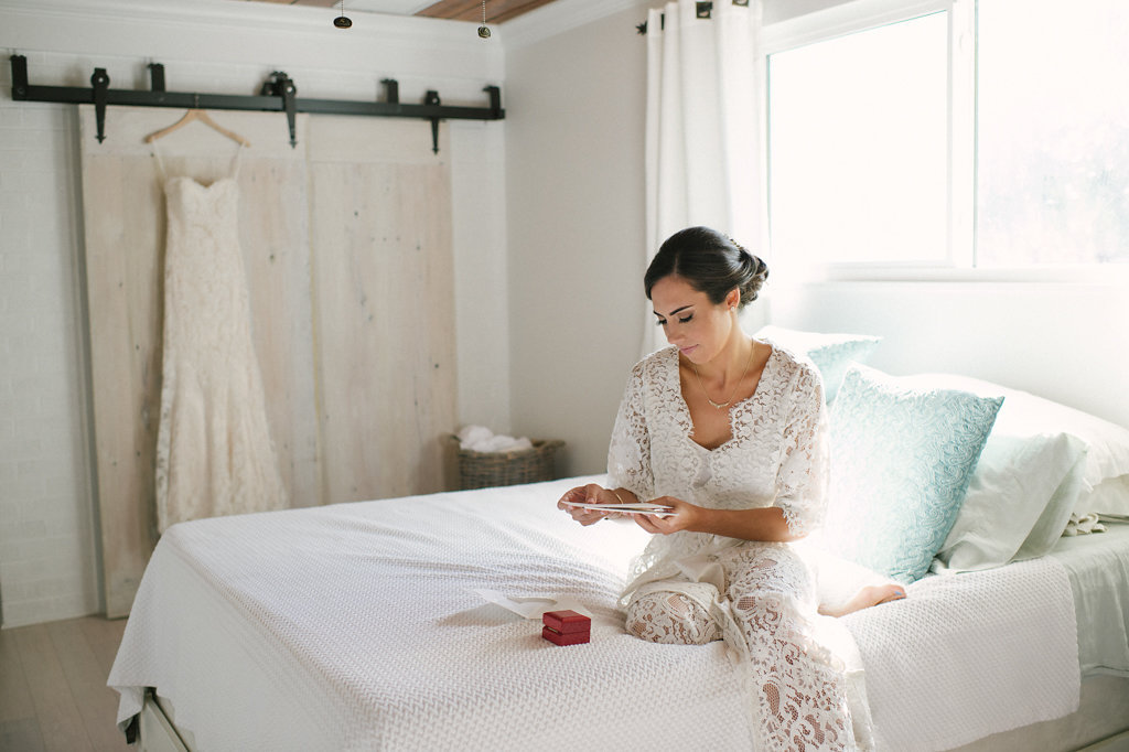 Bride Getting Ready Wedding Portrait in Lace Robe on Bed | Tampa Hair and Makeup Artist Femme Akoi