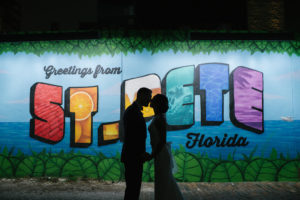 Creative Nighttime Bride and Groom Silhouette Style Wedding Portrait in Front of St. Pete Mural