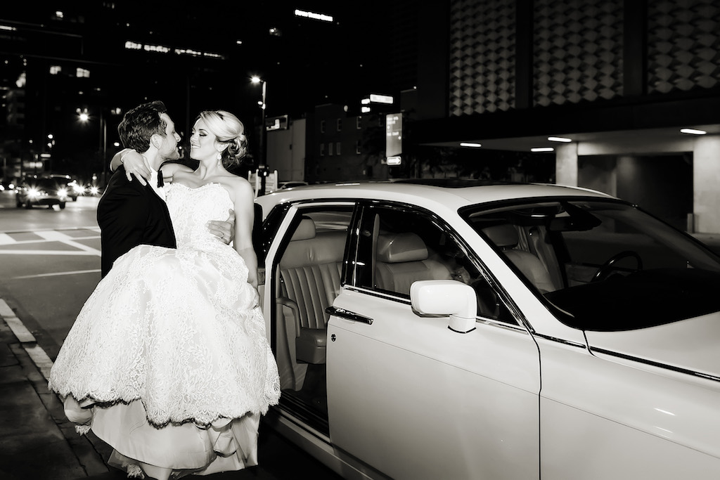 Bride and Groom Wedding Portrait in Front of Vintage Wedding Car
