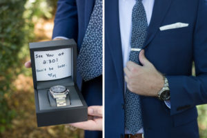 Groom with Watch Wedding Gift from Bride in Navy Blue Suit, Blue Floral Print Tie and White Pocket Square