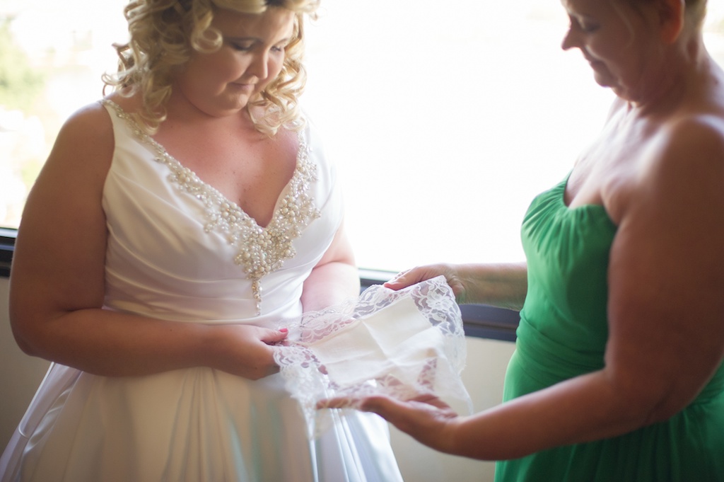 Bride Getting Ready Portrait with Mom Looking at Custom Handkerchief, Bride in Satin V-Neck Ballgown Wedding Dress with Straps and Rhinestone Beading | Tampa Bay Photographer Andi Diamond Photography