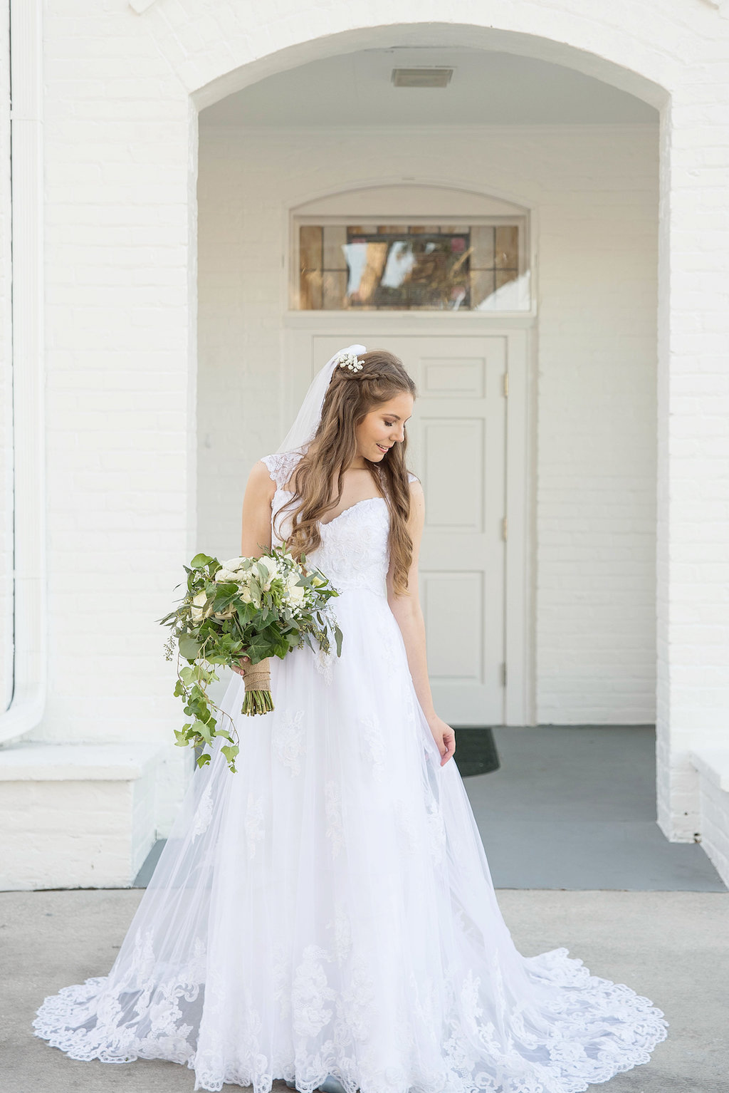 Outdoor Wedding Portrait, Bride in A-Line Lace and Cap Sleeve Wedding Dress and Veil, Greenery and White Floral Bouquet | Tampa Bay Photographer Kristen Marie Photography | Outdoor Bride and Groom Wedding Portrait, Bride in A-Line Lace and Cap Sleeve Wedding Dress and Veil | Tampa Bay Photographer Kristen Marie Photography | Venue Palm Harbor White Chapel and Harbor Hall