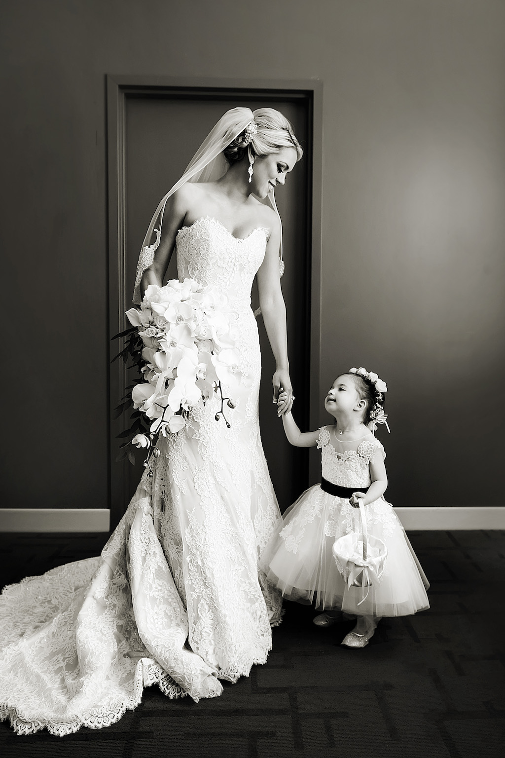 Bride Wedding Portrait in Lace Sweetheart Strapless Fit and Flare Wedding Dress with Orchid Floral Bouquet and Flower Girl