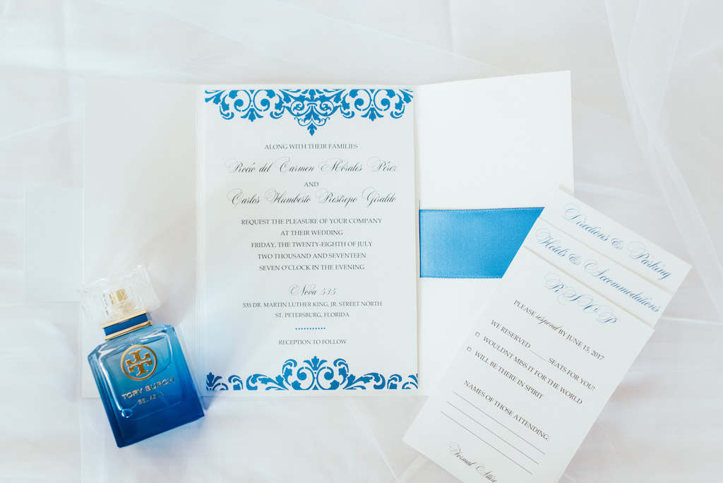 Blue and White Spanish Inspired Wedding Invitation Suite and Tory Burch Perfume Bottle