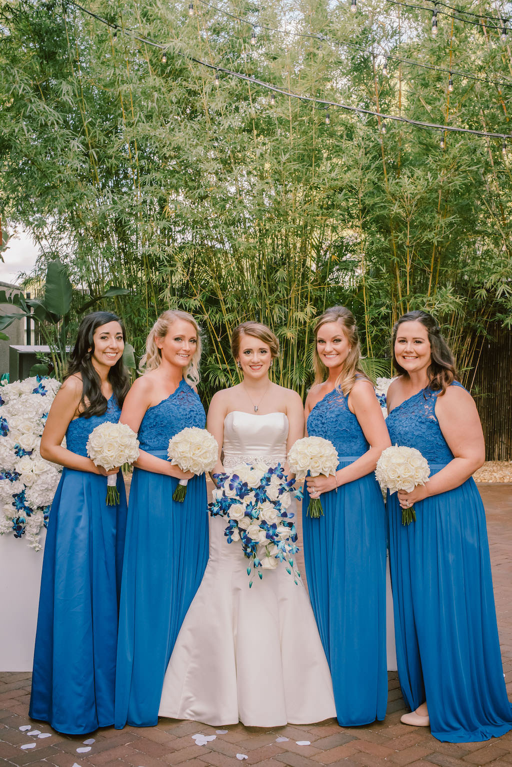 Bride and Bridesmaids Outdoor Bamboo Garden Wedding Portrait, Bridesmaids in Blue Matching Long Dresses, Bride in Strapless Sweetheart Satin Trumpet Wedding Dress, with White and Blue Floral Bouquet | Tampa Bay Wedding Venue NOVA 535
